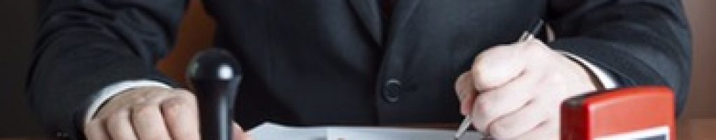 Notary Public in his office signing a contract